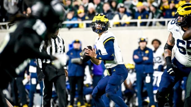 Michigan's J.J. McCarthy looks to throw against Michigan State during the second quarter on Saturday, Oct. 21, 2023, at Spartan Stadium in East Lansing.  